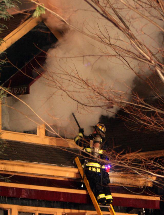 Mutual aid Katonah Old Deer Park Fire. Chief McGill vents the front windows.